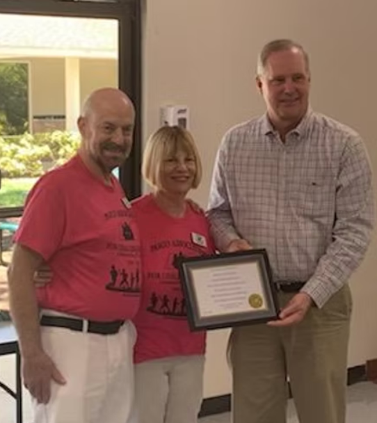 A couple receiving an award