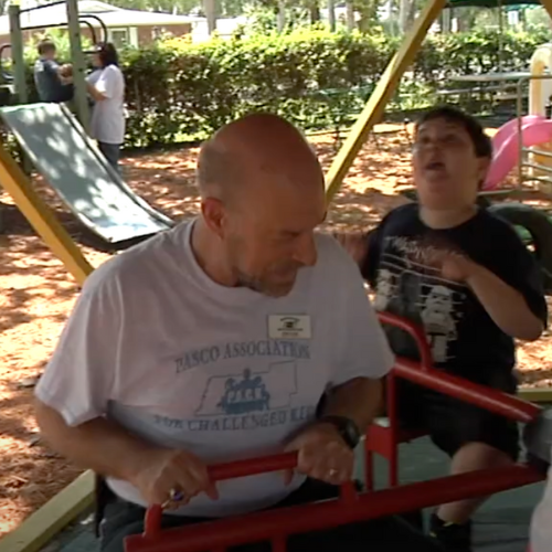 A man and boy at the playground